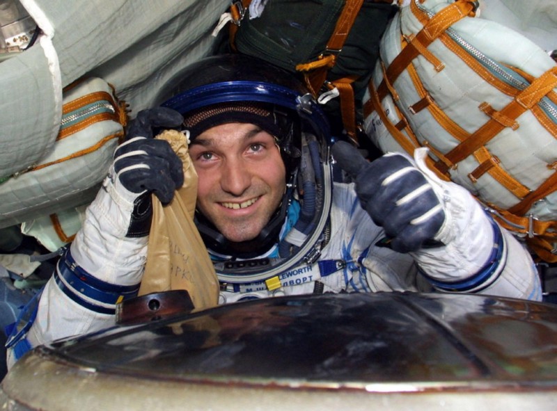 Mark Shuttleworth in astronaut suit in a space shuttle