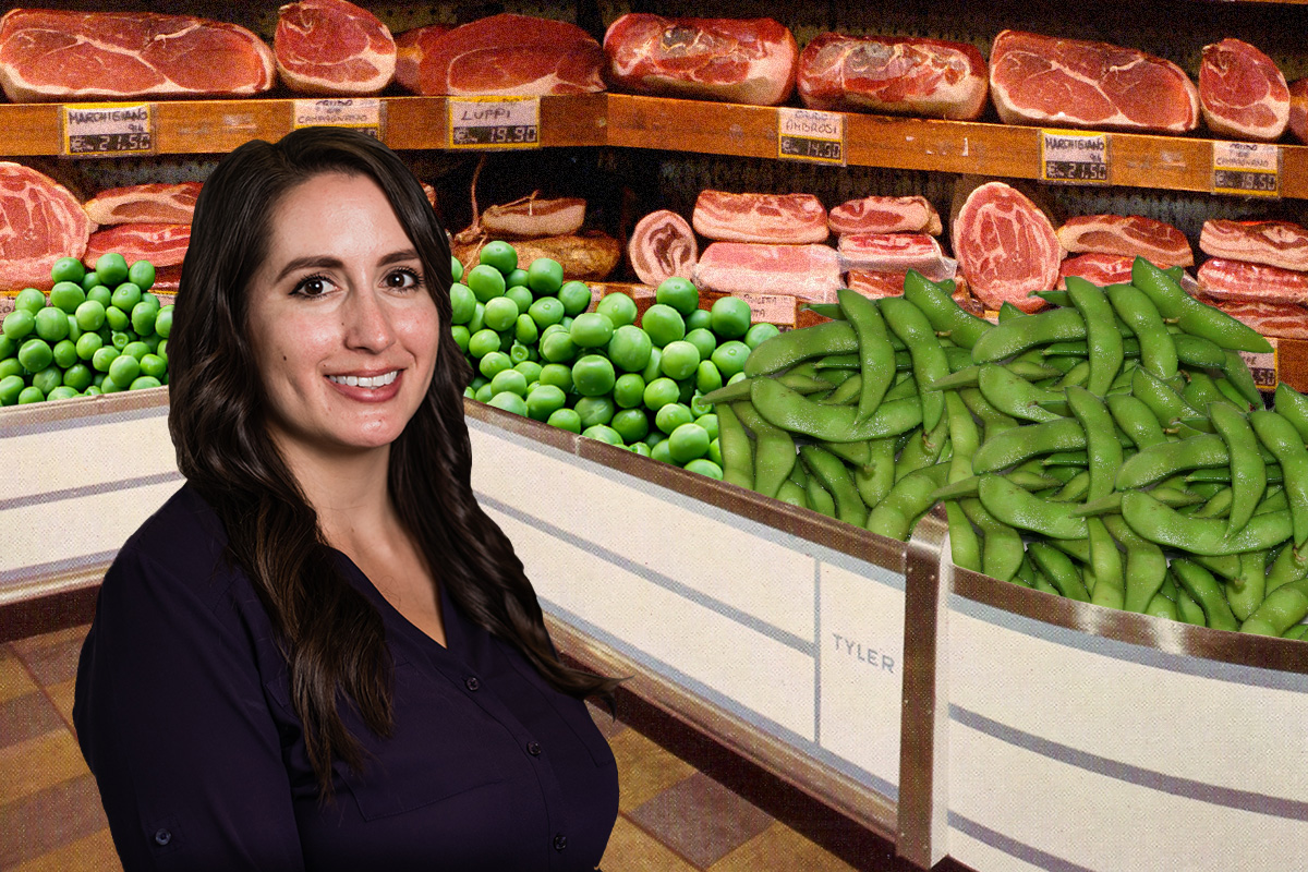 Stephanie Kawecki in front of meat counter