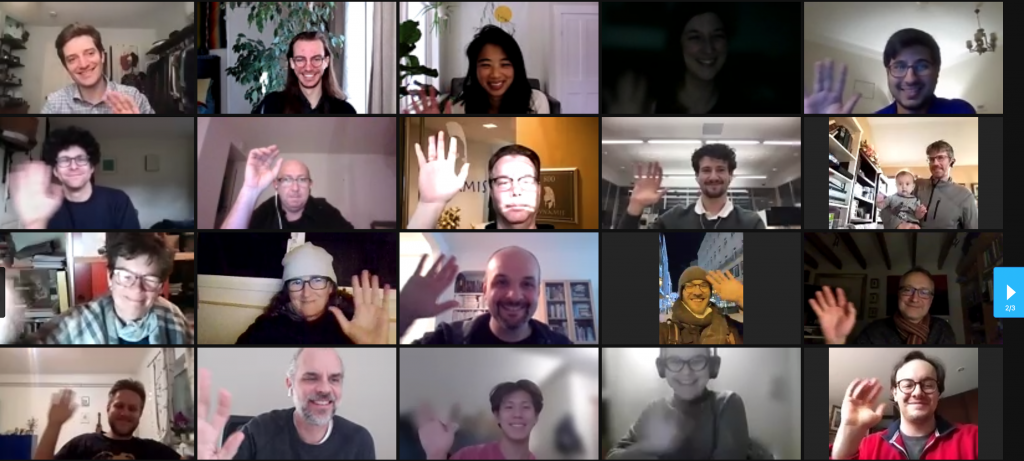 screenshot of people in zoom windows waving at camera